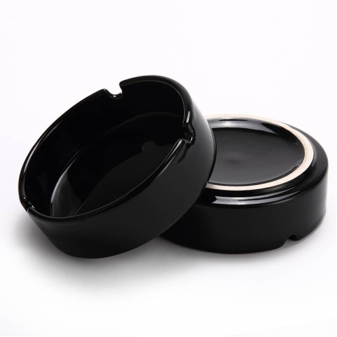 Deep round-cavity ashtray with a glossy solid-black glaze