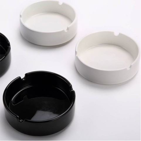 Deep round-cavity ashtray with a glossy solid-black glaze