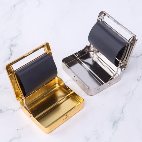 Gold-colored vintage-style engraved metal manual cigarette rolling machine