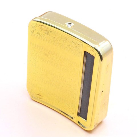 Gold-colored vintage-style engraved metal manual cigarette rolling machine