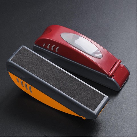 Stylish orange and black plastic manual cigarette roller