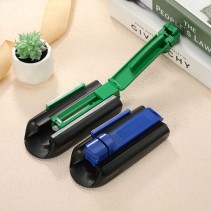Portable manual cigarette roller in a yellow and black color scheme